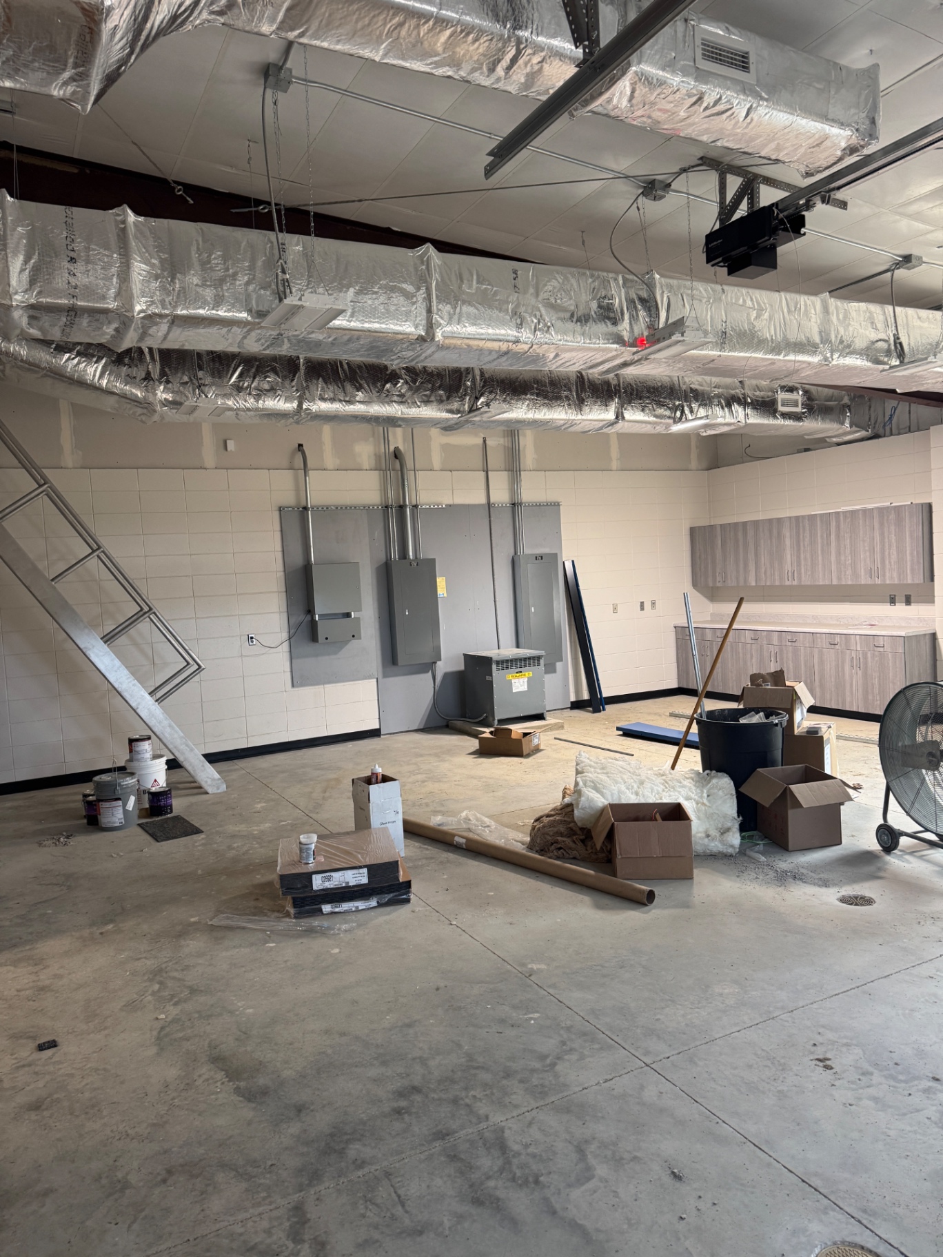Electrical panels and exposed ceiling systems during interior construction